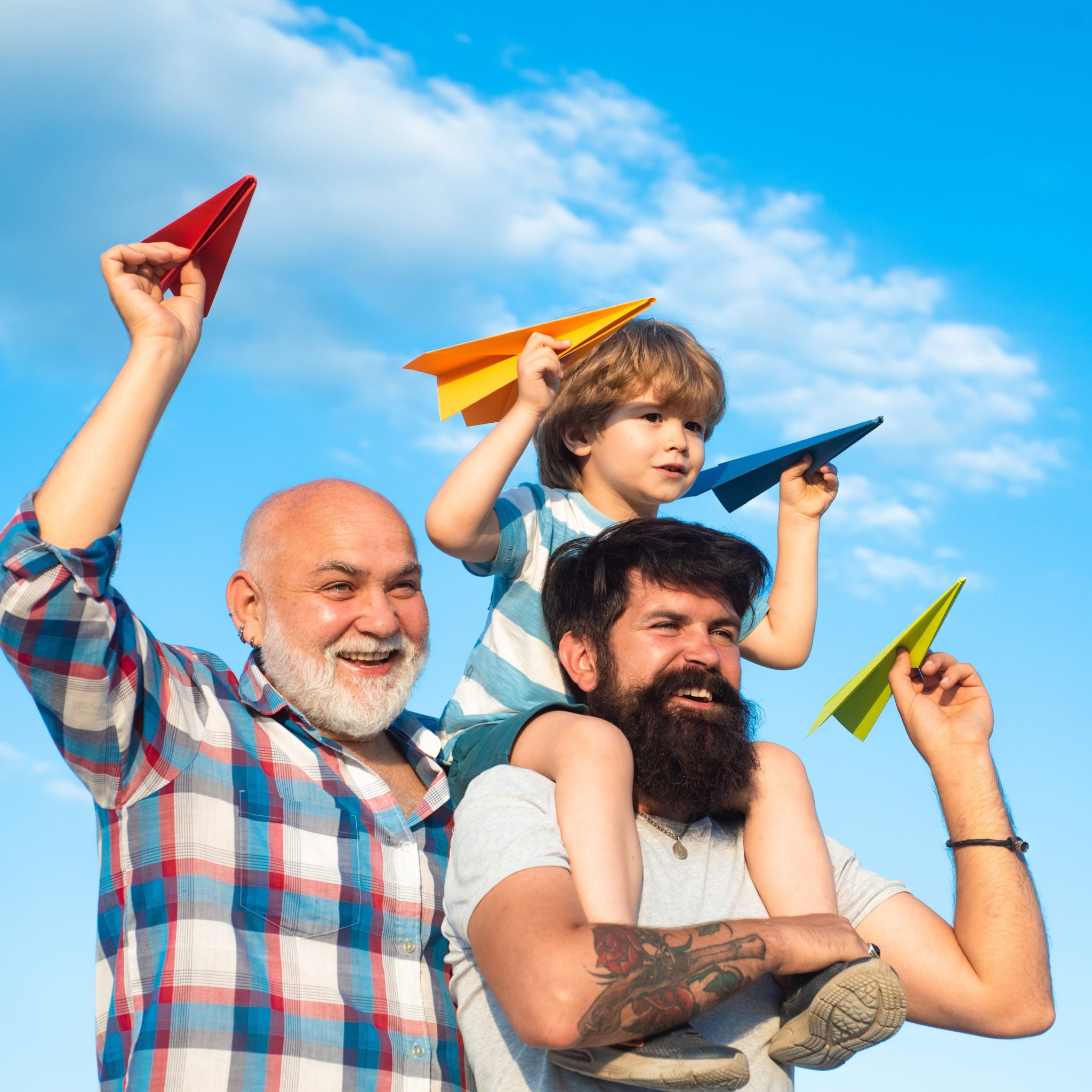 Fathers and sons flying paper planes