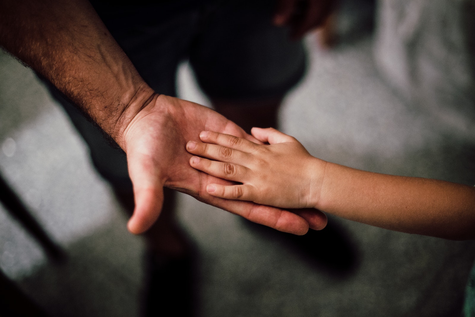 Father and Child's Hands Together